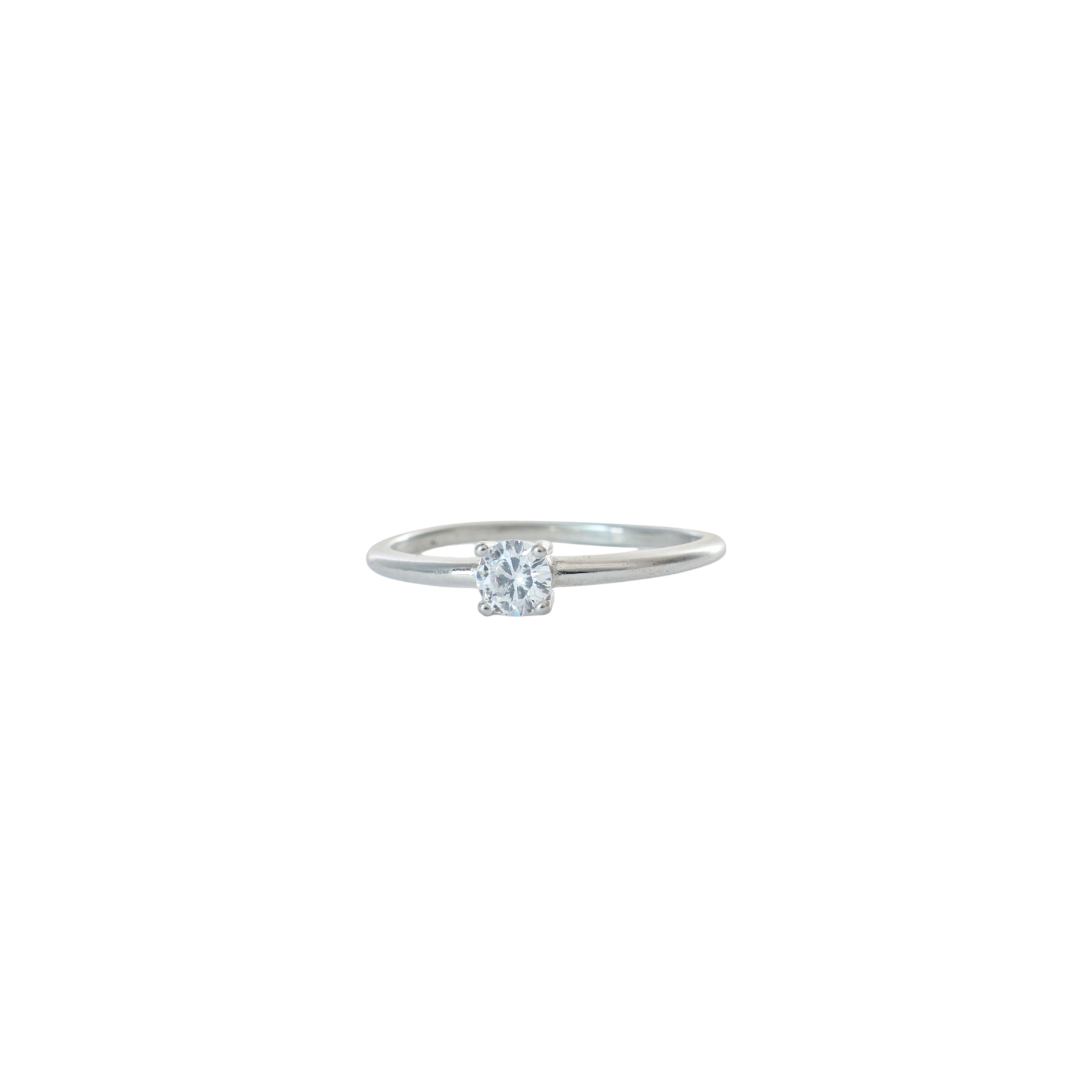 Dainty round solitaire clear gem set on a thin sterling silver band.