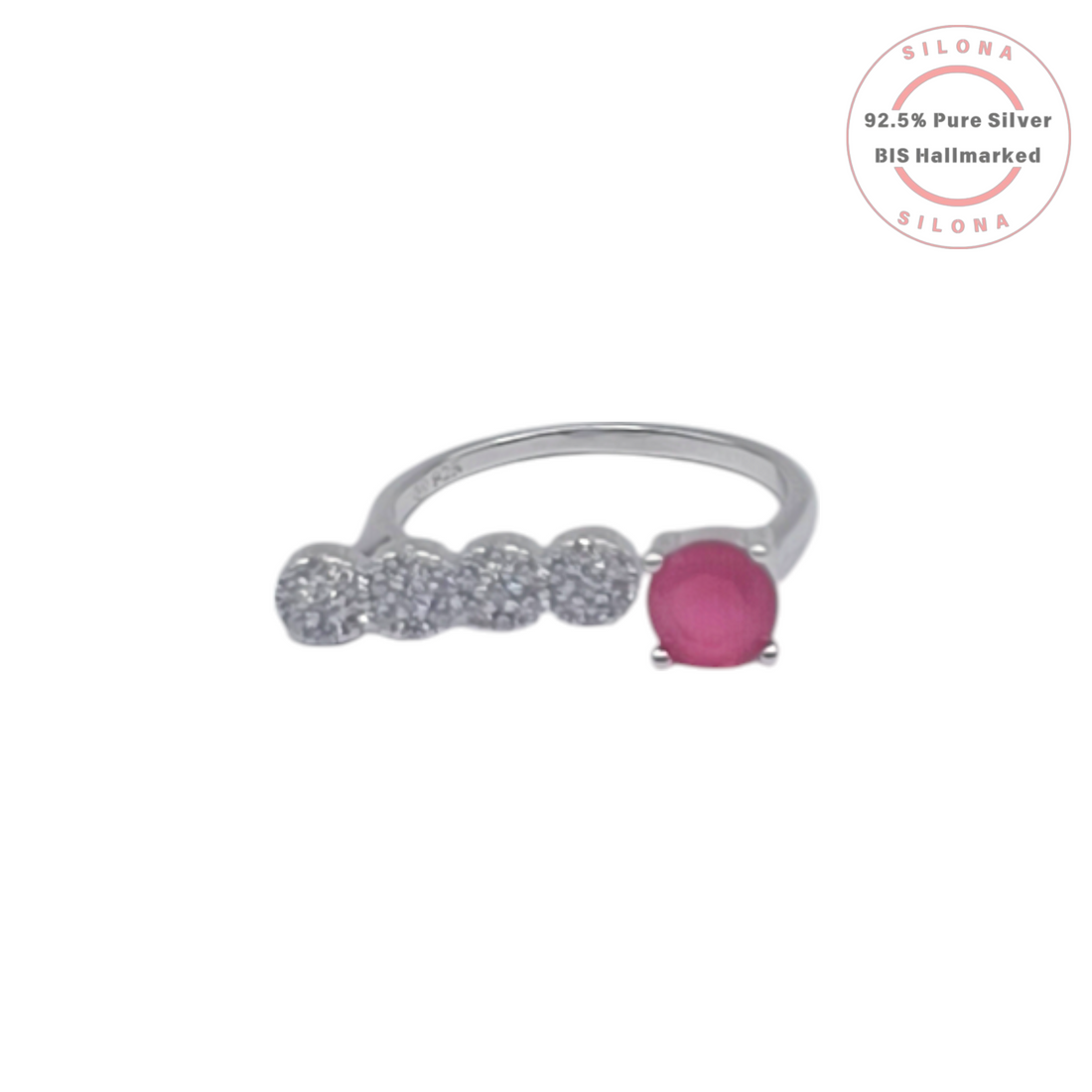 A modern open bypass ring in 92.5 silver, featuring a round ruby-hued stone on one end and a row of four clear pavé zircons on the other, on a white background.