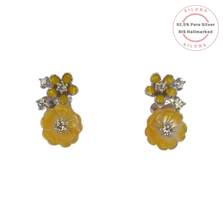A pair of Silona silver floral earrings featuring a carved yellow flower drop and a smaller yellow enamel flower stud, accented with cubic zirconia.