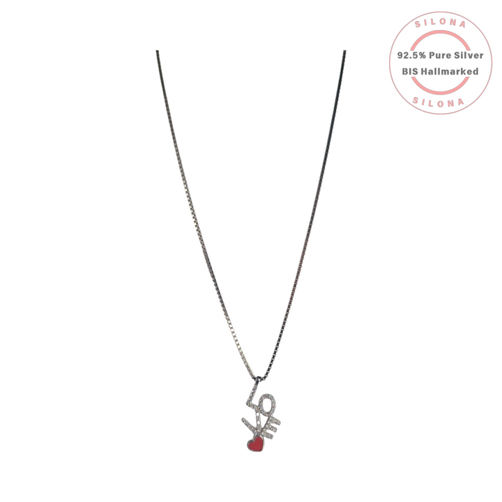 Silona's Pavé Love & Heart Necklace in 92.5 silver, featuring a 'LOVE' script pendant with brilliant cubic zirconia and a red enamel heart, on a dual-tone silver box chain.