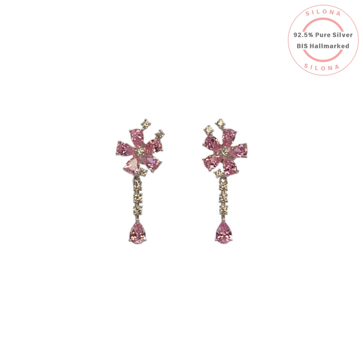 A pair of Silona floral dangler earrings with pink and champagne cubic zirconia stones, crafted in sterling silver on a white background.