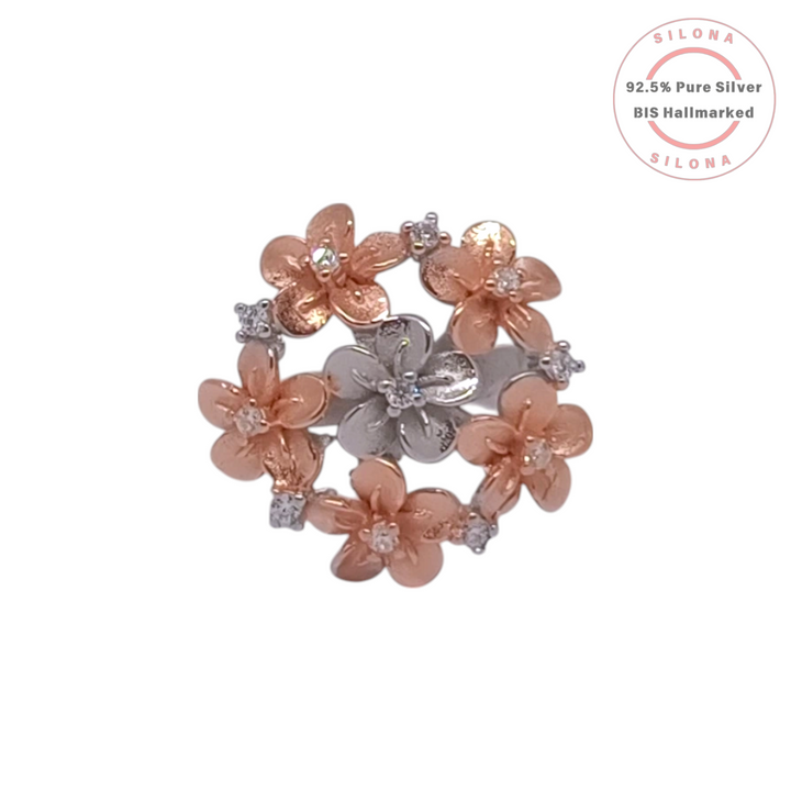 A dual-tone floral wreath ring with rose gold and silver blossoms, studded with cubic zirconia, crafted in 92.5 silver.