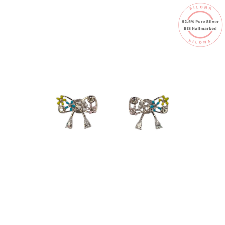 A pair of Silona's Floral Bow Stud Earrings in 92.5 silver, featuring colorful enamel work in blue, yellow, and pink with dangling cubic zirconia details, on a white background.