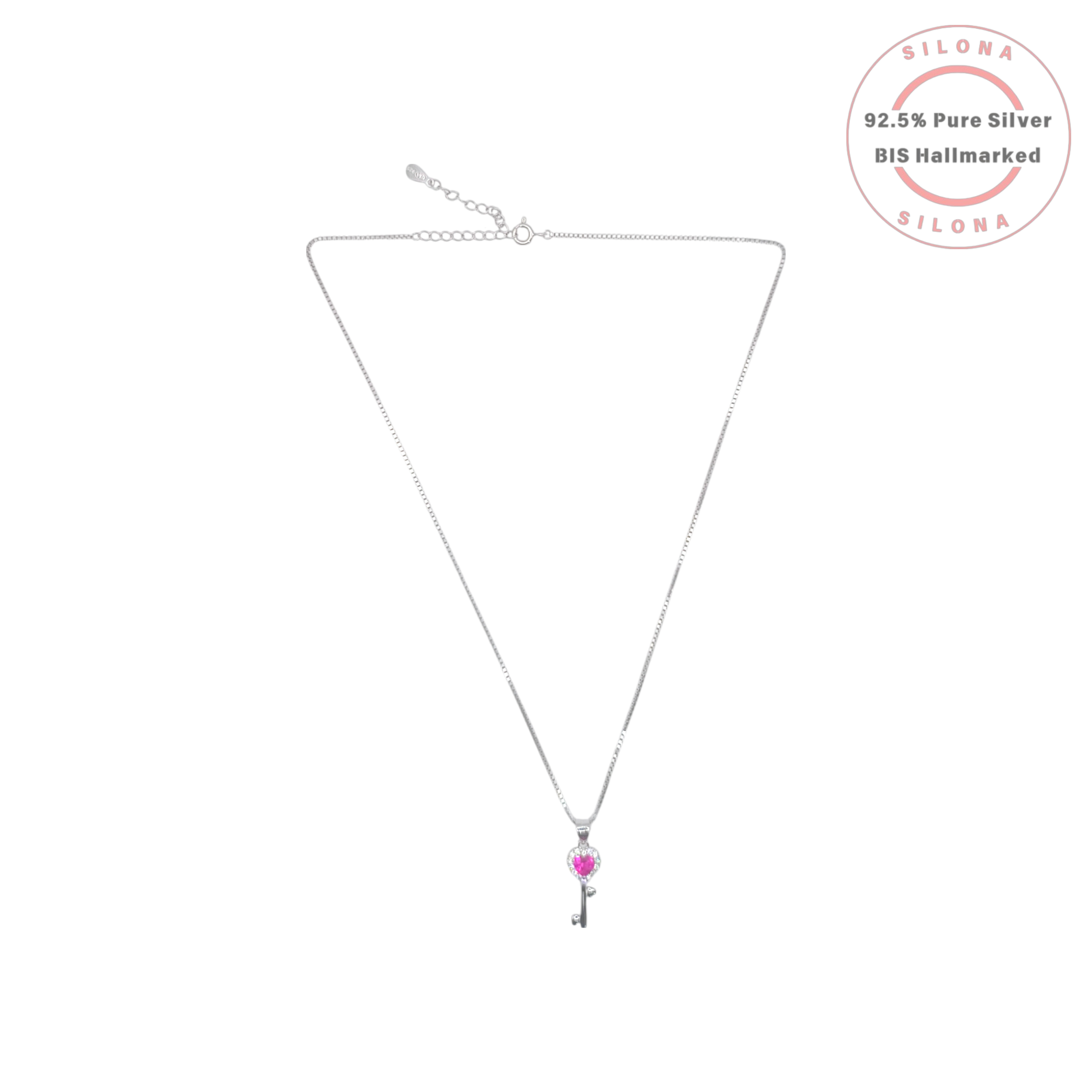 Dainty silver key pendant necklace featuring a heart-shaped pink stone on a silver box chain, against a white background.