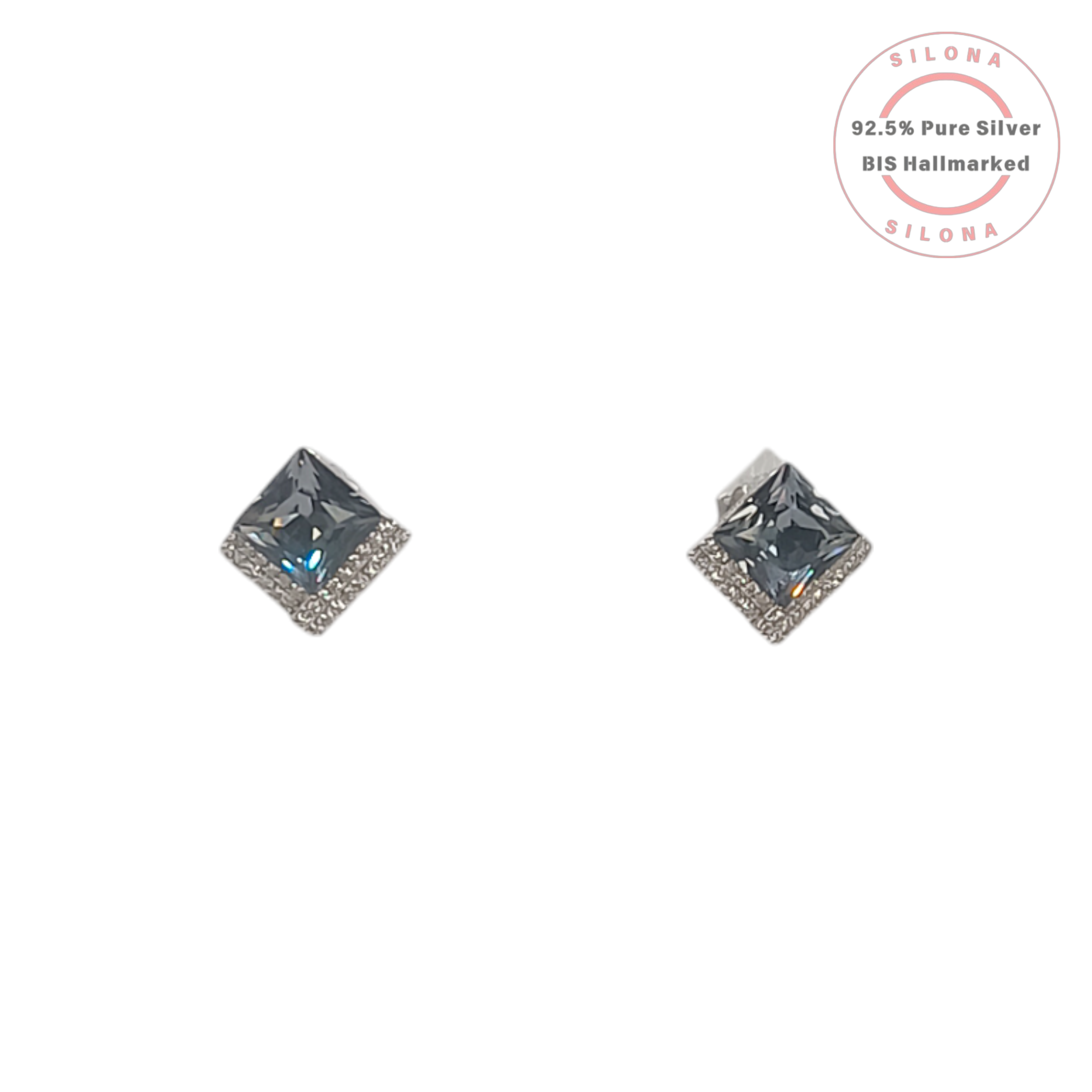 A pair of Silona's Halo Princess Cut Stud Earrings in 92.5 silver, featuring a large grey-blue center stone surrounded by a halo of clear pavé stones, on a white background.