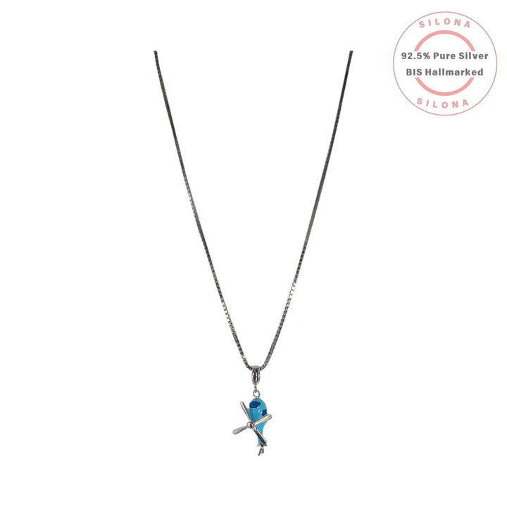 A silver box chain necklace featuring a small airplane pendant with a turquoise-blue enamel body and a silver propeller, on a white background.
