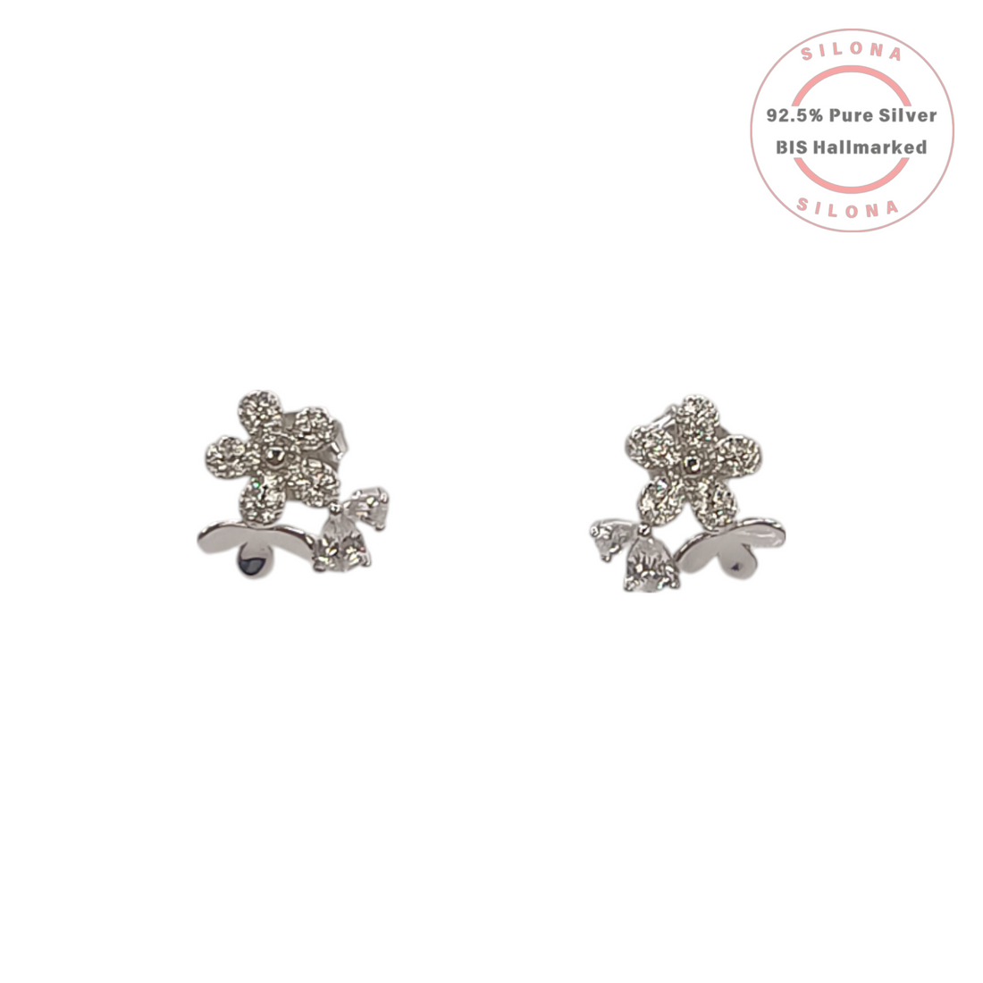 A pair of silver floral stud earrings, paved with brilliant cubic zirconia stones, on a clean white background.