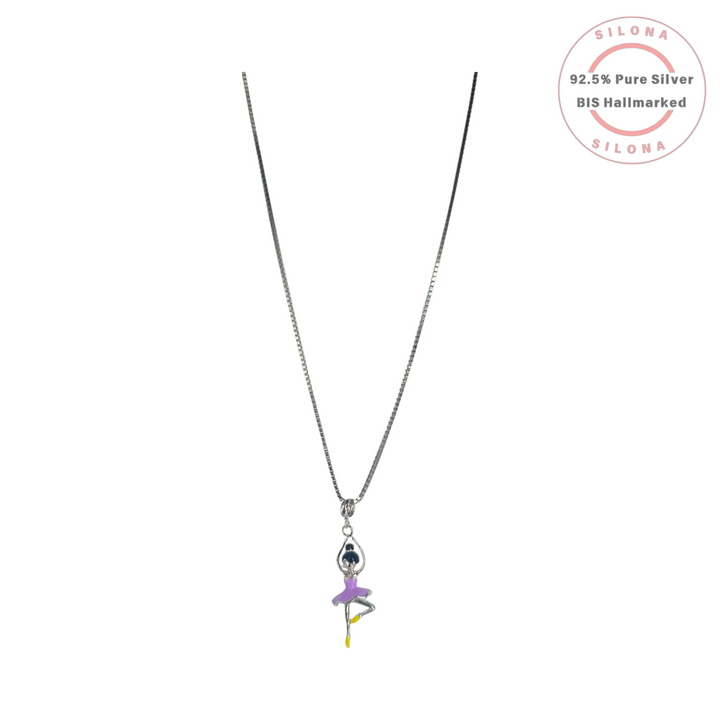 A silver box chain necklace with an enameled ballerina pendant. The ballerina has a lilac purple tutu, yellow shoes, and is crafted from 92.5 silver.