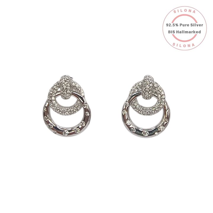 Pair of Silona's Pave Interlocking Circle Earrings in 92.5 silver with cubic zirconia on a white background.
