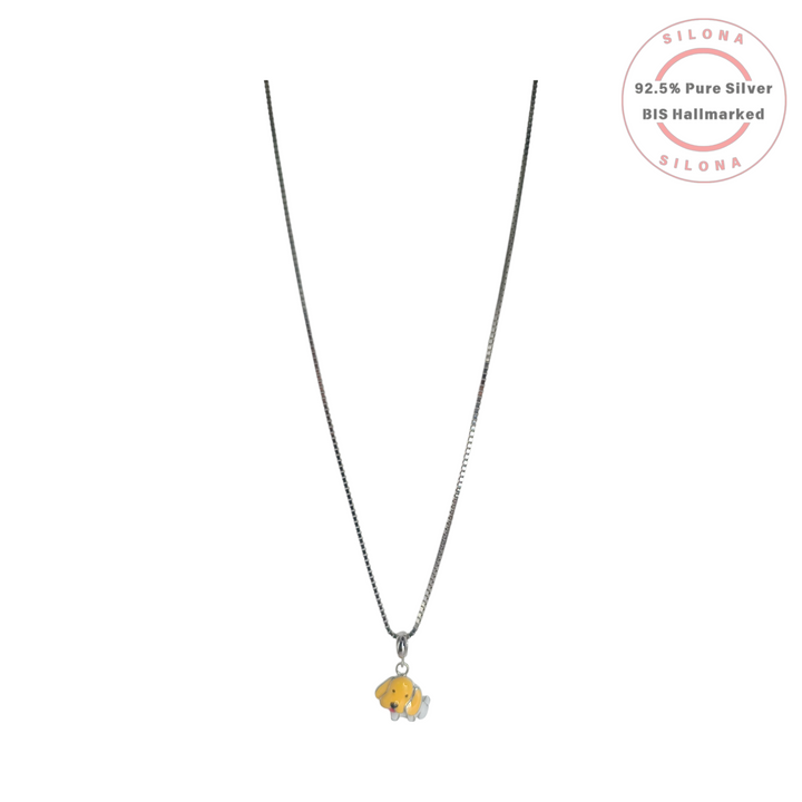 A silver box chain necklace featuring a small, cute puppy dog pendant with yellow and white enamel, on a white background.