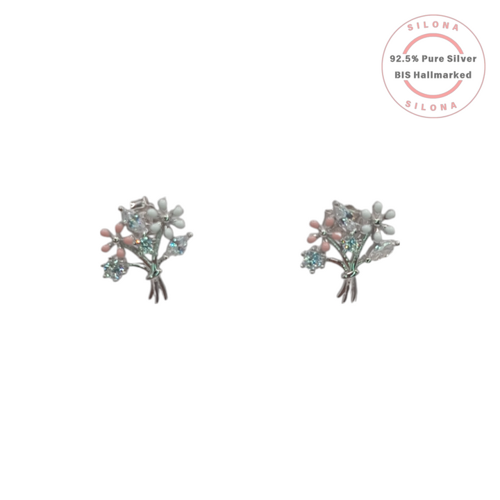 A pair of Silona silver stud earrings shaped like a floral bouquet with pastel pink and white enamel, accented with sparkling aqua and clear stones.
