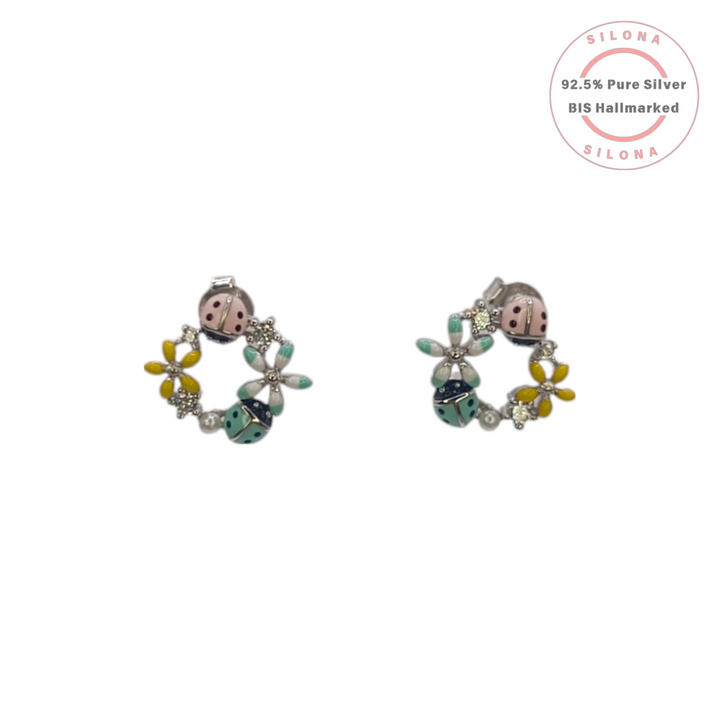 Pair of Silona's Enamel Garden Ladybug & Floral Stud Earrings in pure 92.5 silver, featuring pink and mint green ladybugs and yellow flowers on a white background.