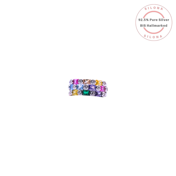 Silona Prismatic Multi-Hue Eternity Ring featuring alternating round and princess-cut rainbow cubic zirconia set in a 92.5 silver wide band.