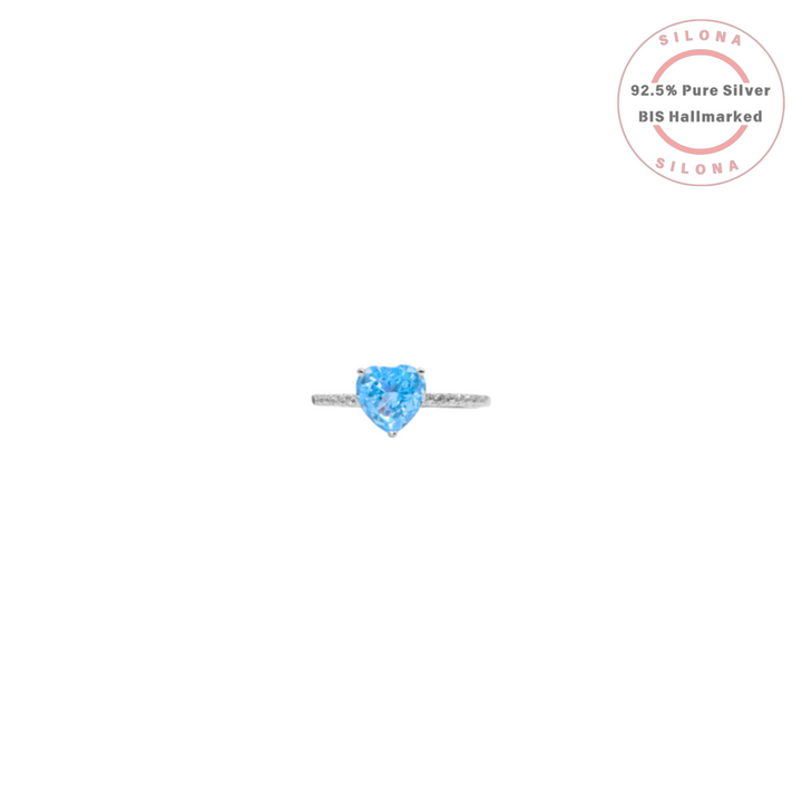 Silona Aquamarine Hue Heart Promise Ring in 92.5 Silver with a paved band, shown on a white background.