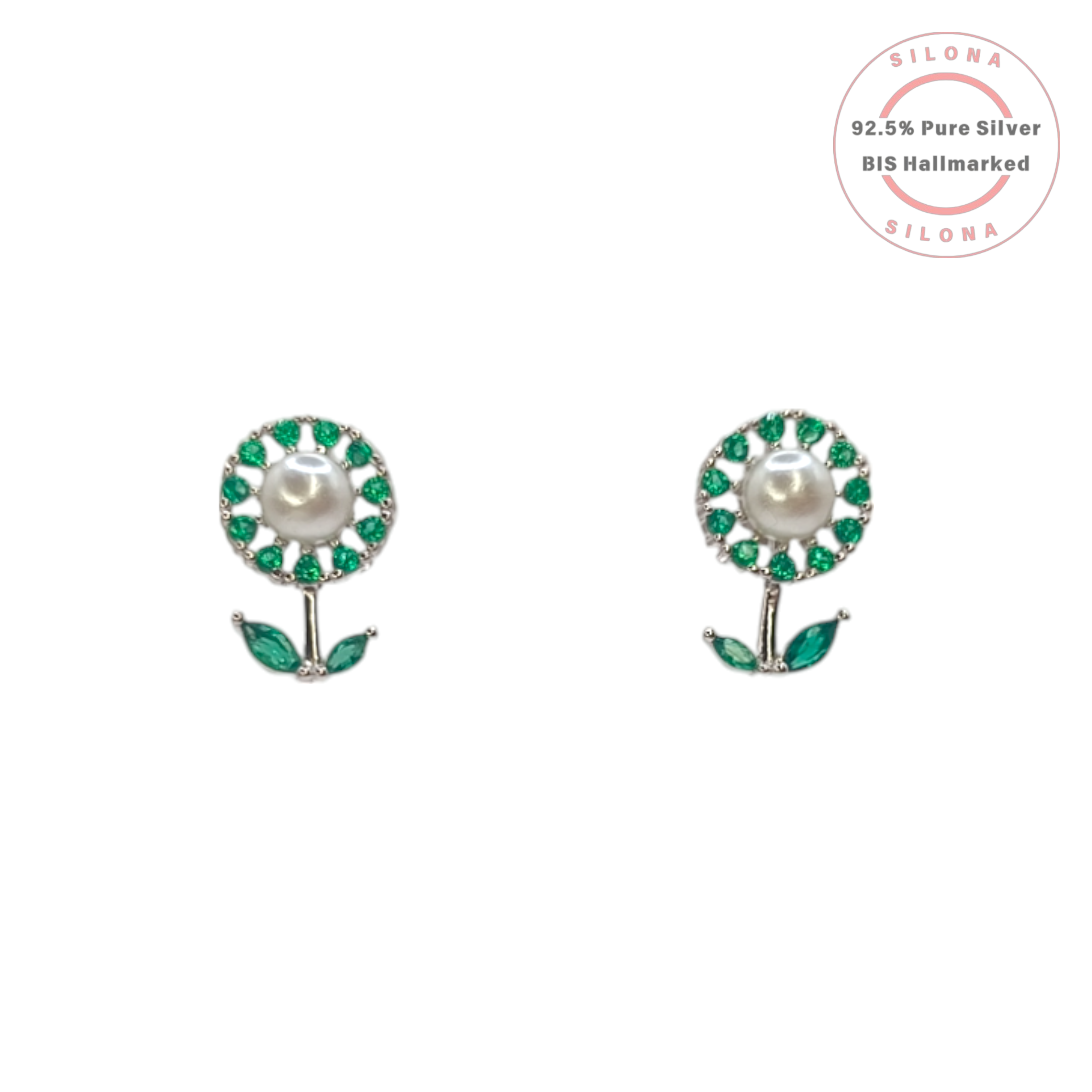 A pair of silver floral stud earrings with a central pearl, surrounded by emerald-green stones, with a stem and two leaves.