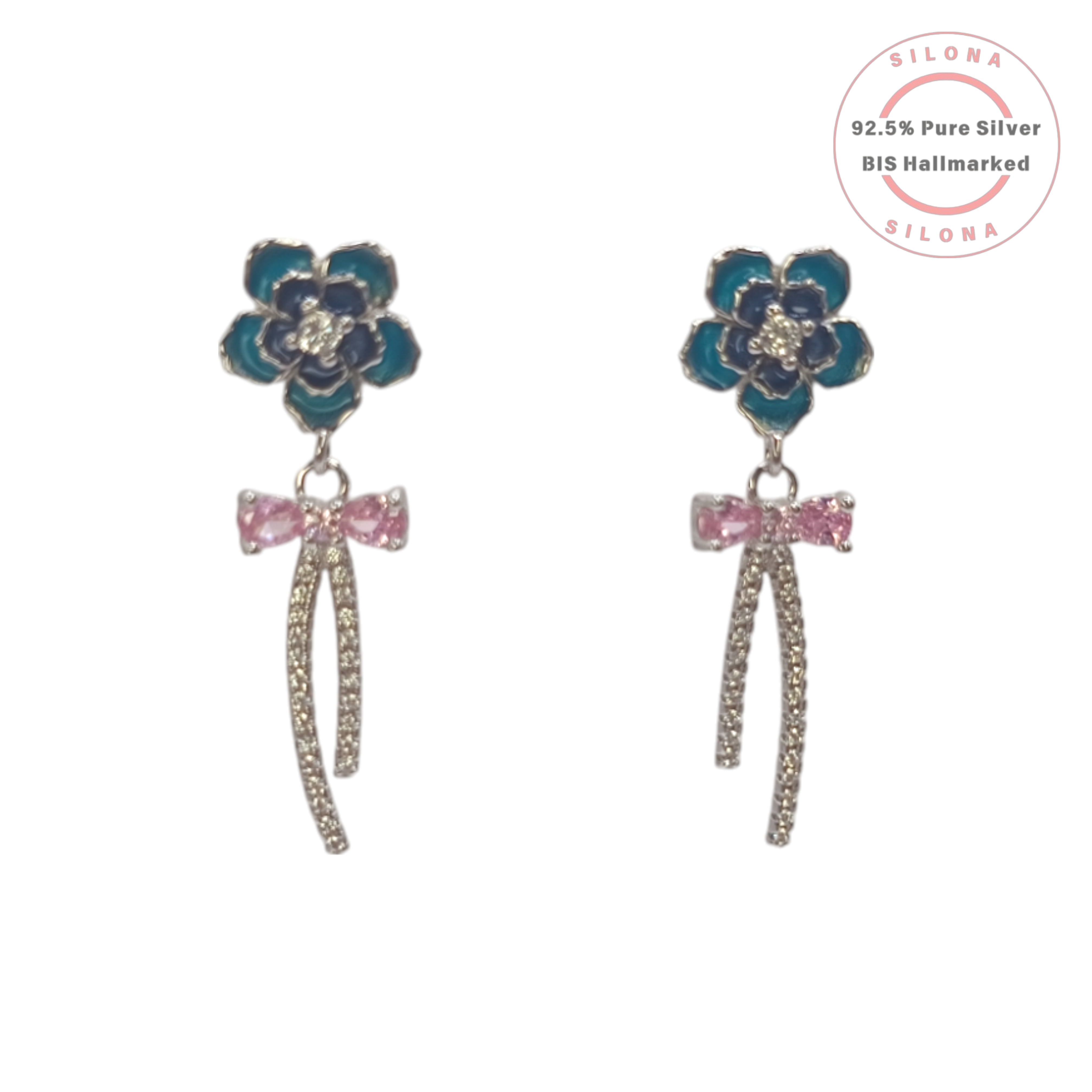 A pair of Silona's Blossom & Bow Drop Earrings in 92.5 silver, featuring a blue enamel flower stud, a pink cubic zirconia bow, and a dangling pavé silver strand, on a white background.