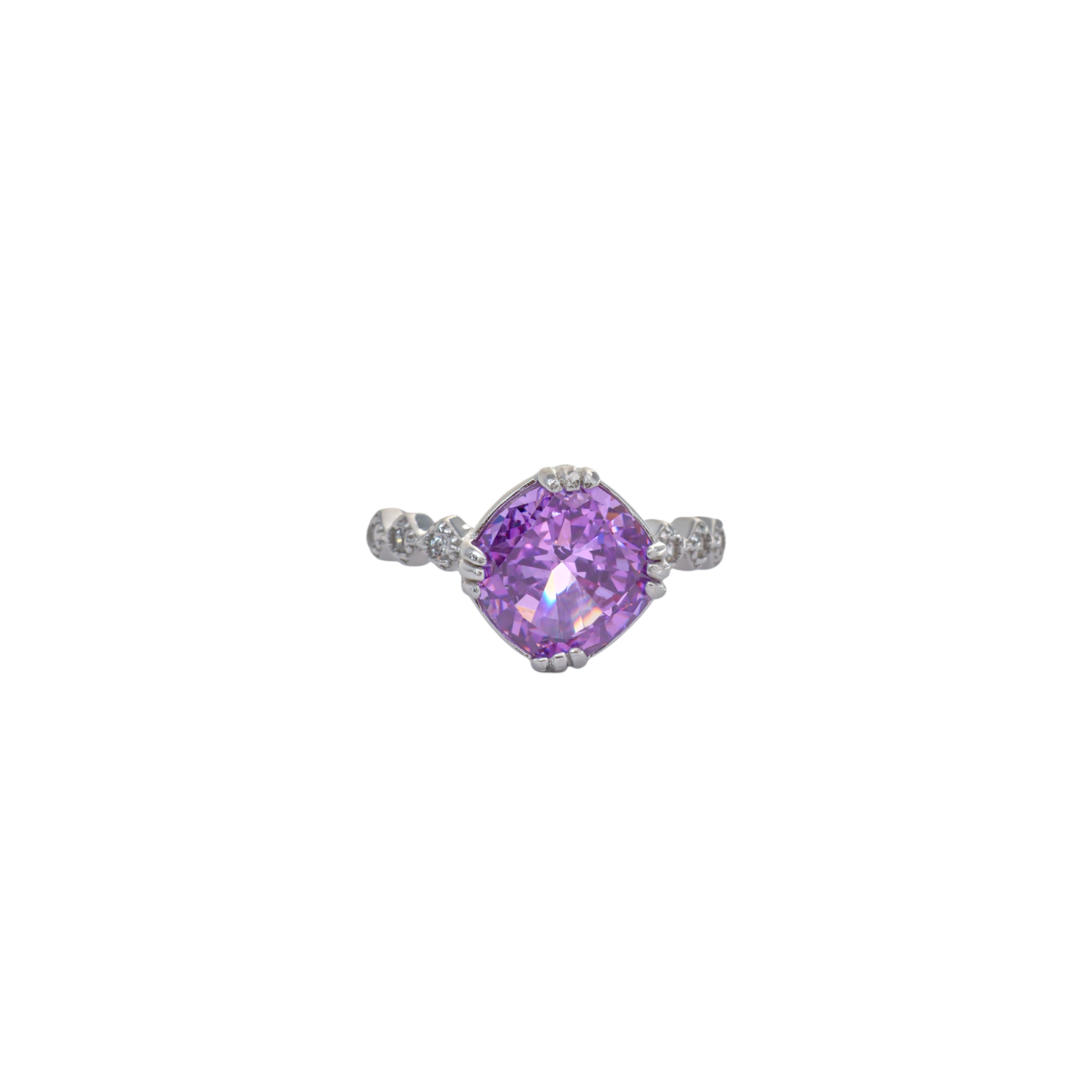 Vibrant violet cushion gem set on an ornate textured silver band with pave accents.