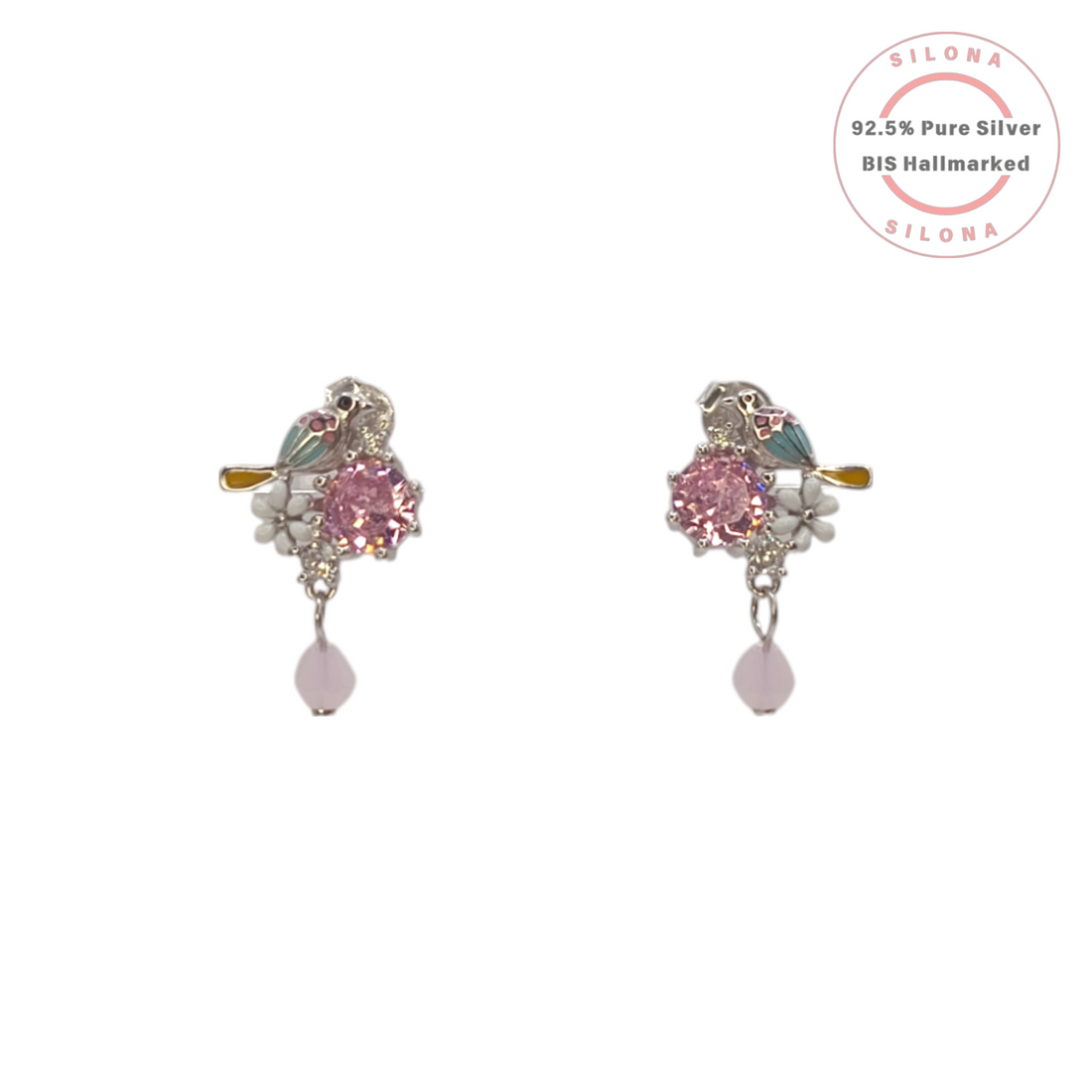 Pair of Silona enamel lovebird stud earrings in 92.5 silver, featuring a large pink cubic zirconia, white enamel flowers, and a dangling pink bead.