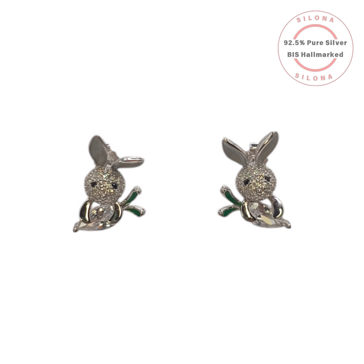 A pair of silver bunny stud earrings with pavé cubic zirconia, green enamel detail, on a white background.