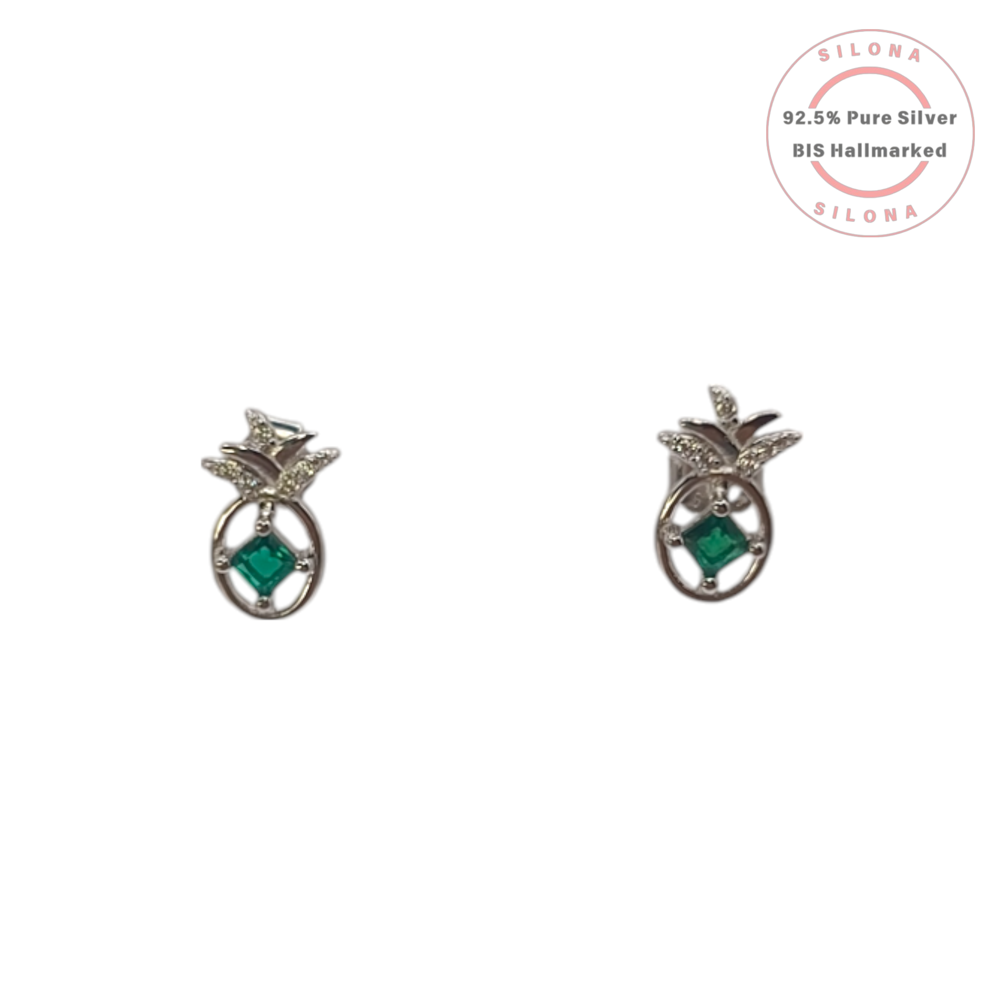 A pair of silver pineapple stud earrings, each with a central emerald-green square stone and sparkling cubic zirconia on the leaves, shown on a white background.