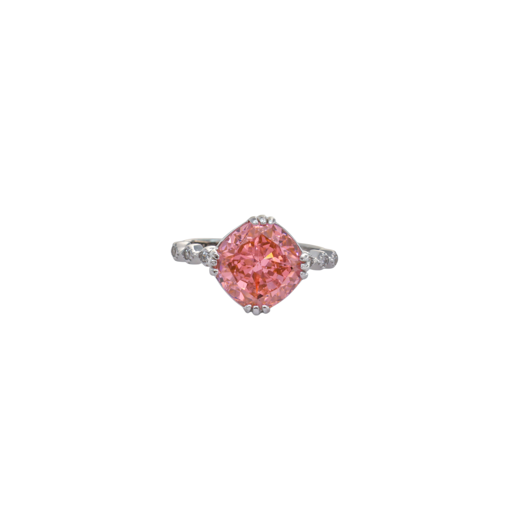 Warm coral pink cushion cut gemstone set on a scroll textured silver ring.