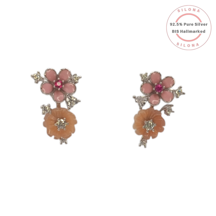 A pair of Silona's Carved Bicolor Flower Stud Earrings, featuring a pink and a peach flower in 92.5 silver with cubic zirconia accents, on a white background.