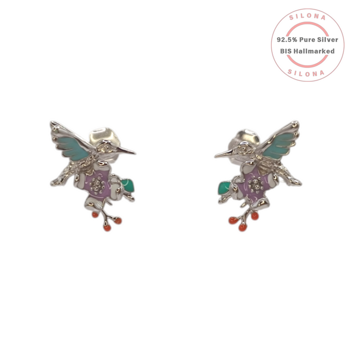 A pair of Silona hummingbird stud earrings in pure 92.5 silver, detailed with pastel lilac, aqua, and coral enamel, on a white background.