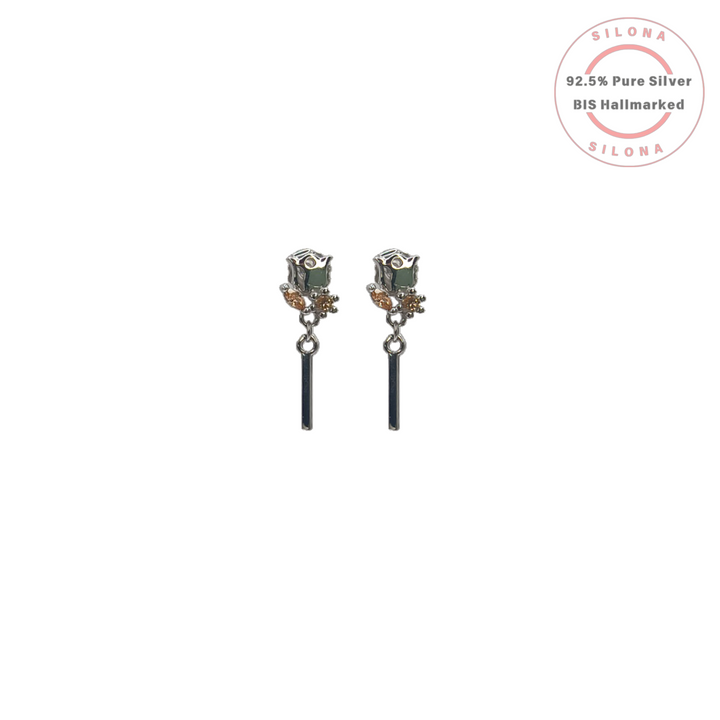 A pair of Modern Rosebud Drop Earrings in 92.5 silver, featuring a sage green stone stud, champagne crystal accents, and a dangling silver bar, on a white background.