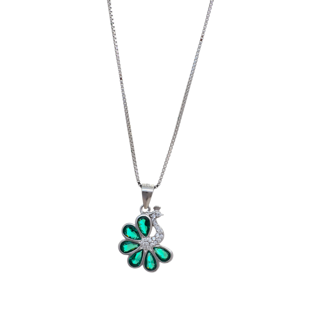 Silver box chain necklace with a peacock pendant featuring pear-cut emerald green crystals for tail feathers and a sparkling cz body.