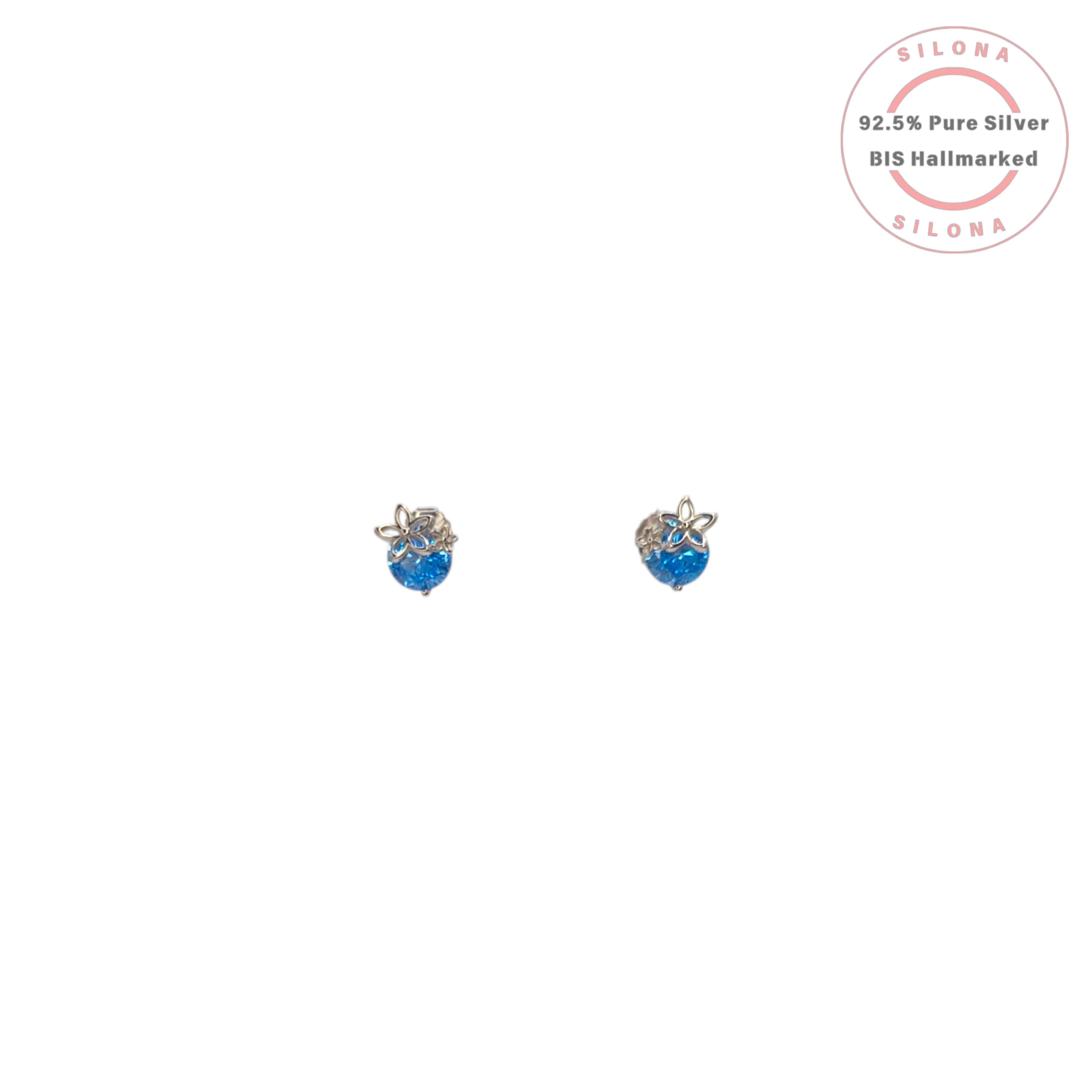 A pair of Silona Dainty Floral Stud Earrings in 92.5 silver, featuring a round aquamarine-blue stone topped with a small silver flower motif.