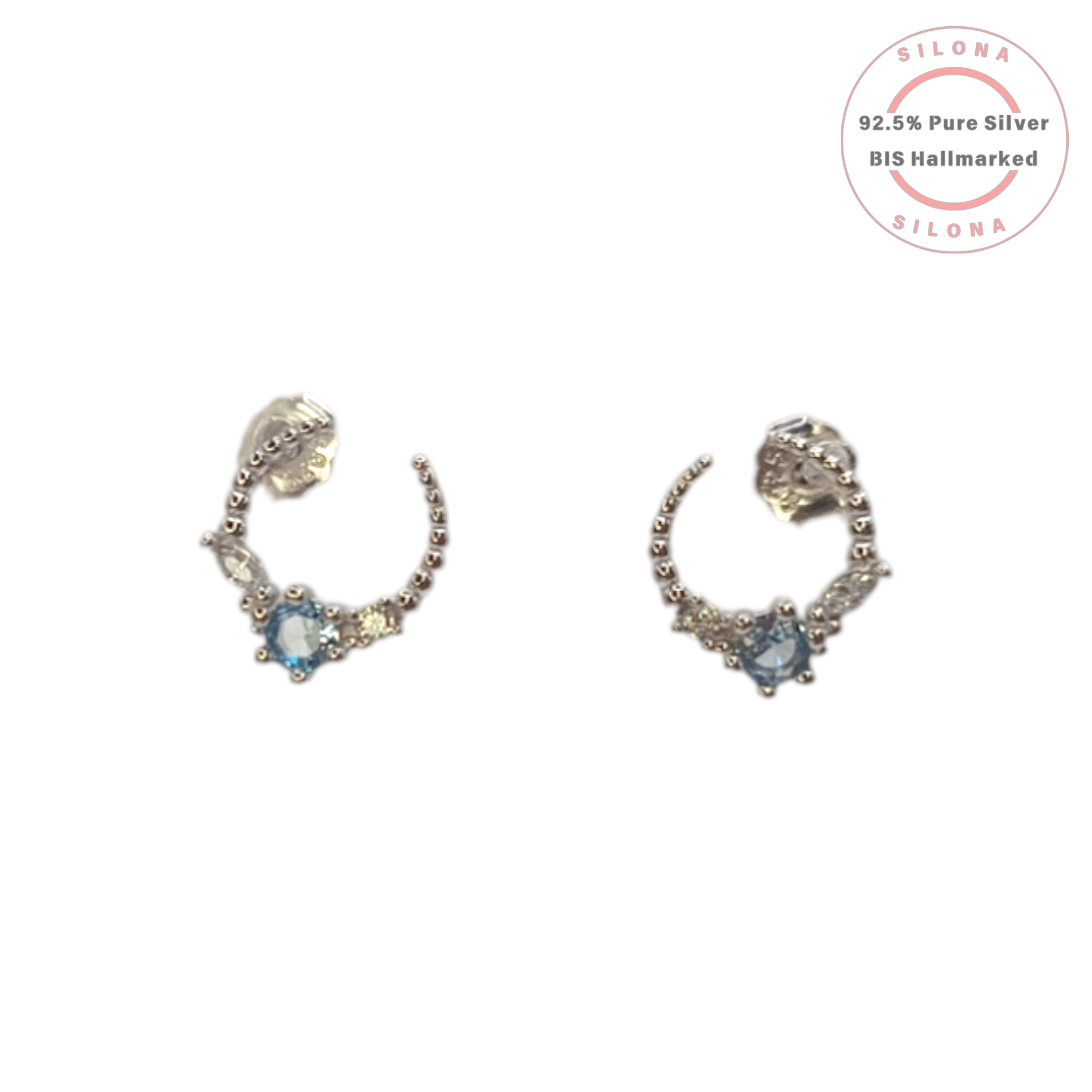 A pair of Silona Celestial Arc stud earrings in 92.5 silver, featuring a central light blue stone and clear side stones, on a white background.
