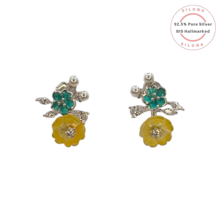 A pair of Silona floral stud earrings in 92.5 silver, featuring a teal enamel flower and a carved yellow flower drop with cubic zirconia accents.