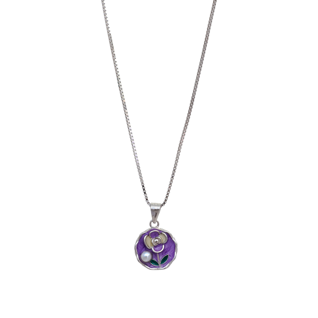 Silver box chain necklace featuring a round purple enamel medallion with a mother-of-pearl flower motif and a dangling white pearl.