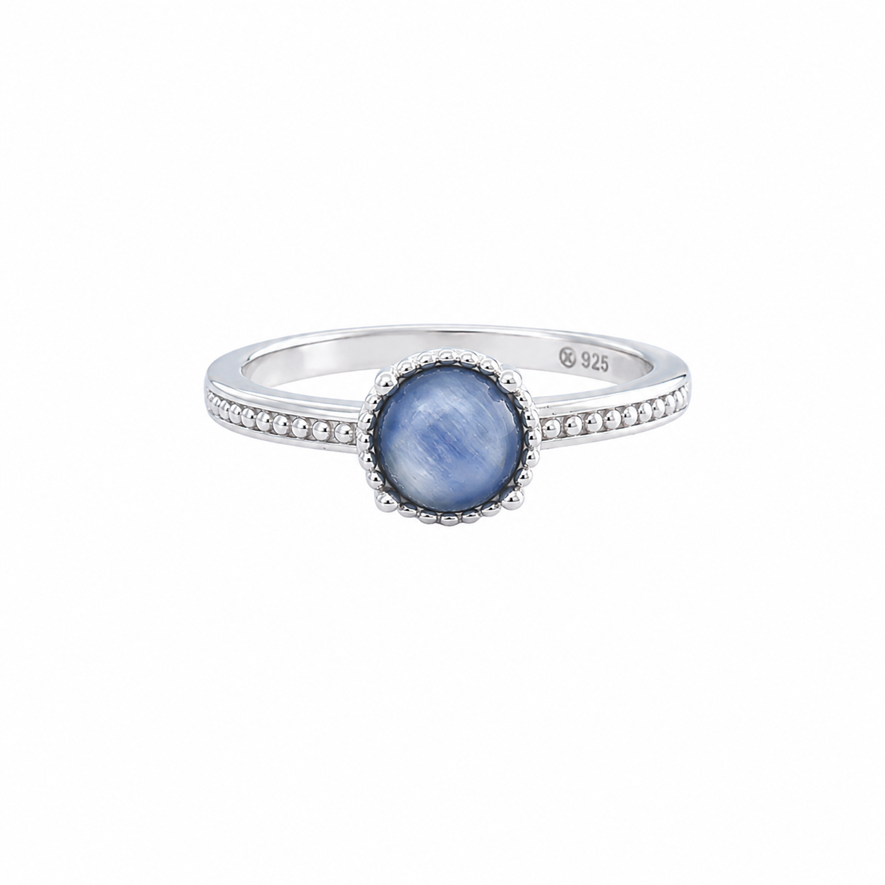 Round blue kyanite stone with chatoyant sheen encircled by a beaded silver halo on a thin band.