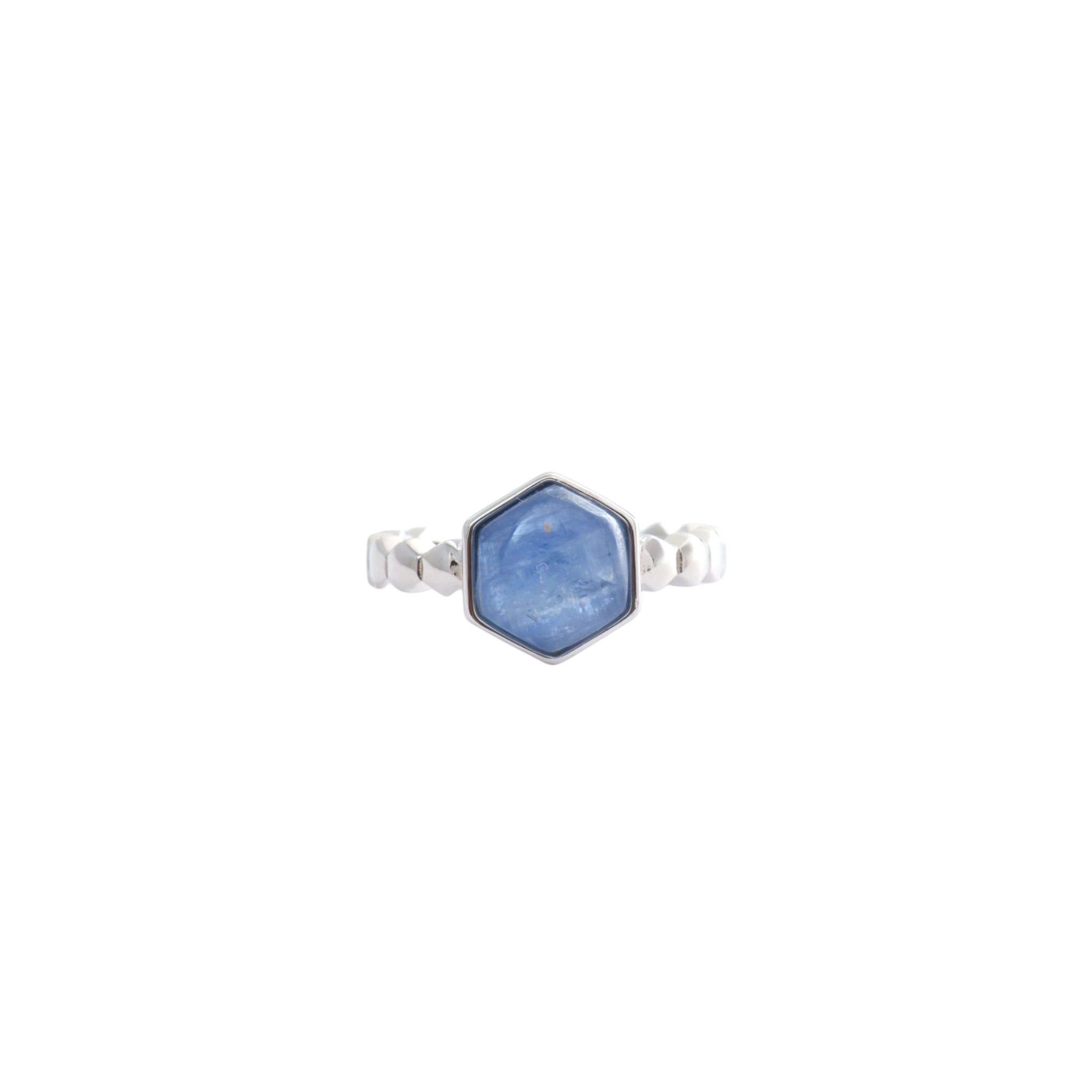 Hexagonal blue kyanite stone mounted in a bezel setting on a faceted silver ring.
