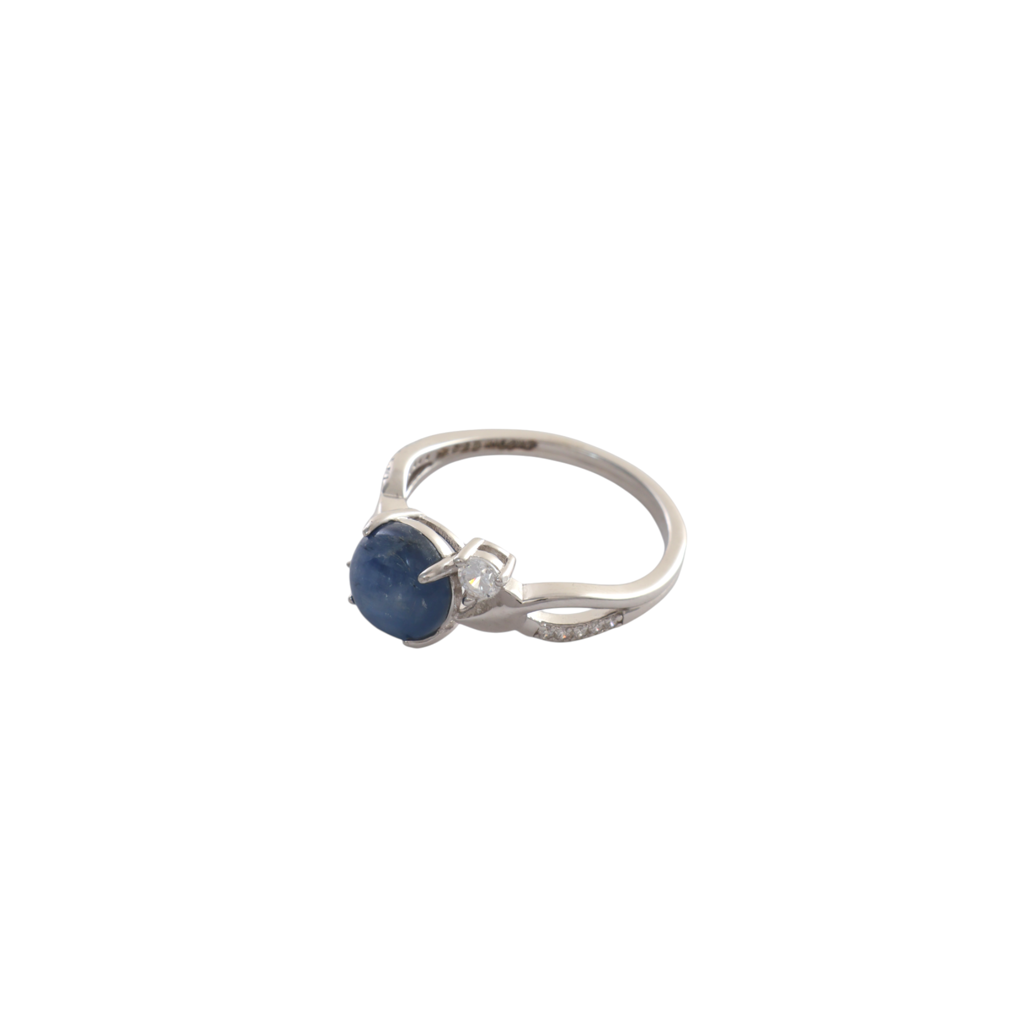 Round kyanite blue cabochon nestled between sweeping pave cz bypass arms in silver.