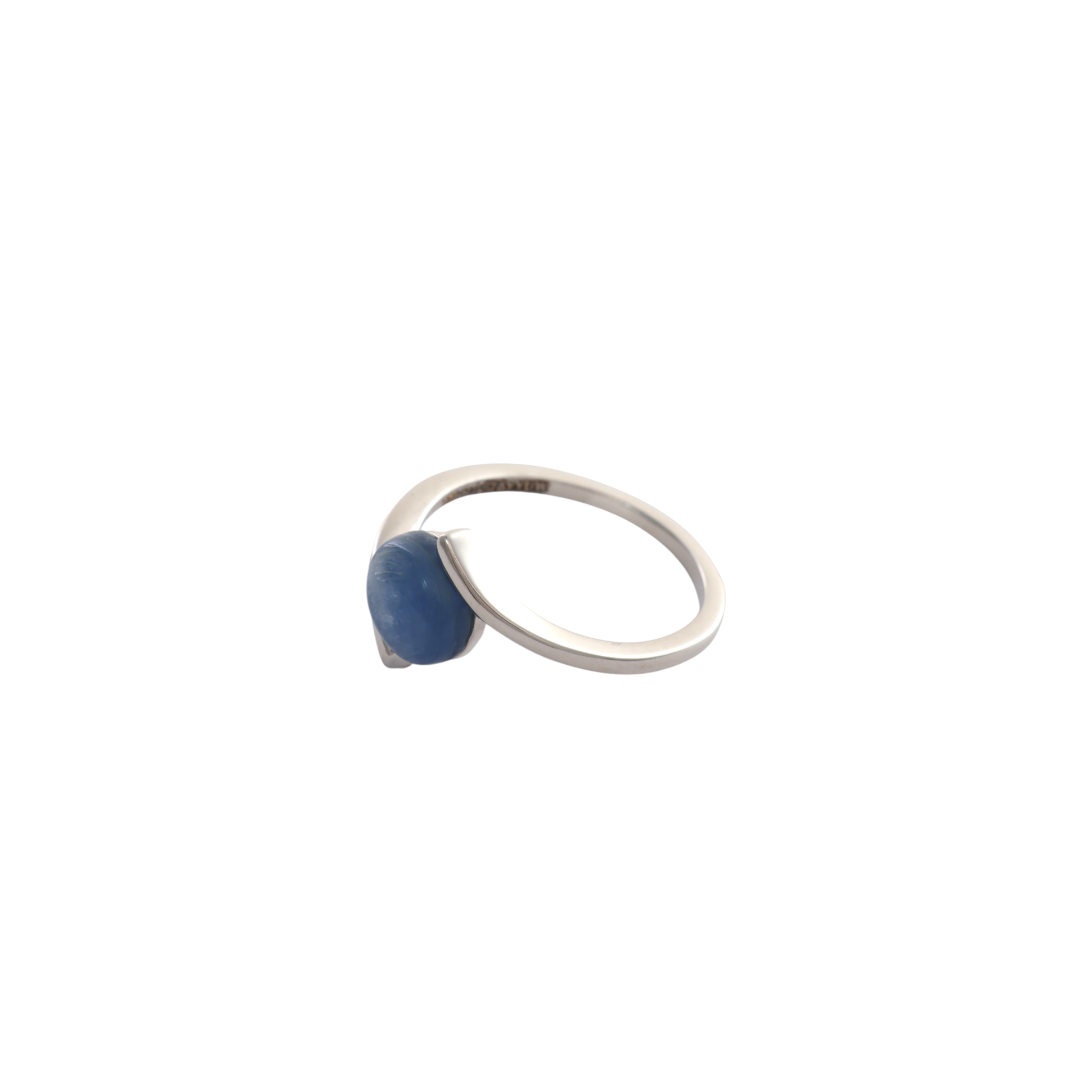 Round blue kyanite cabochon held securely between fluid asymmetrical silver bypass bands.