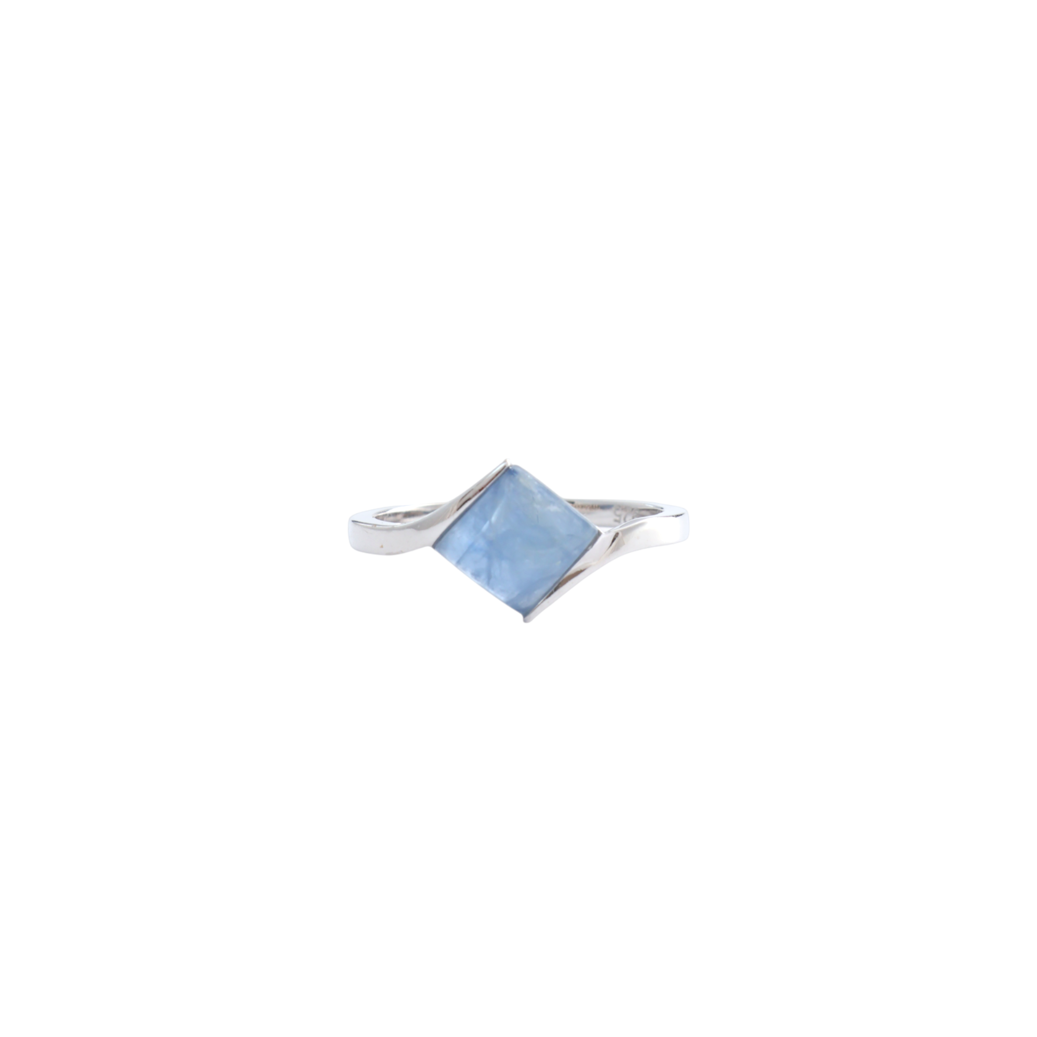 Diamond-shaped blue kyanite cabochon set diagonally between sweeping silver bypass shanks.