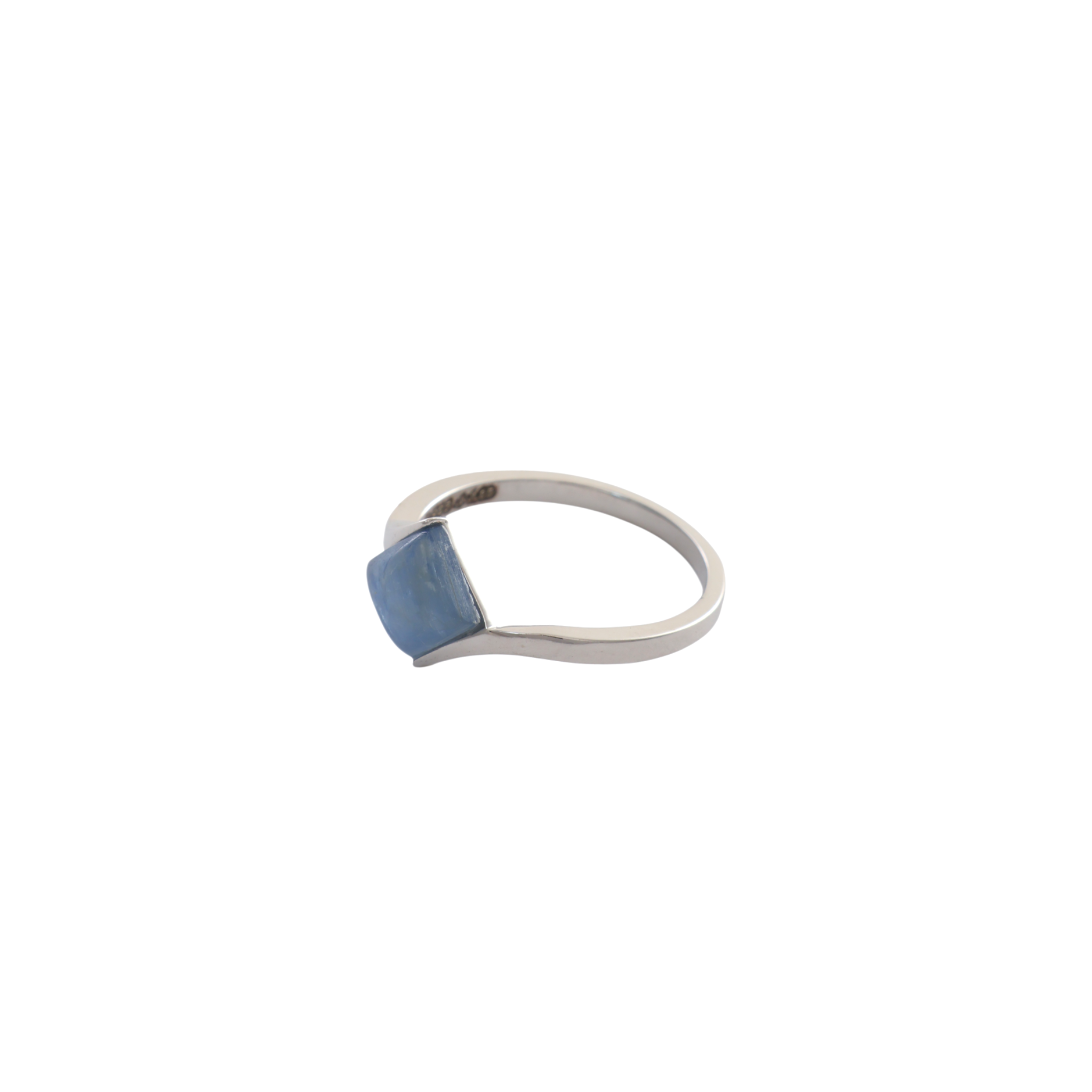 Diamond-shaped blue kyanite cabochon set diagonally between sweeping silver bypass shanks.