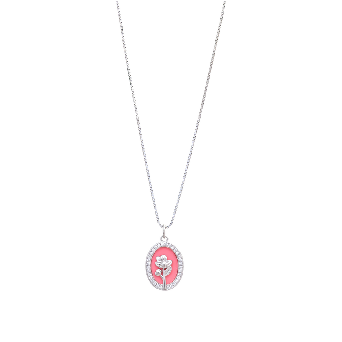 Silver chain necklace with an oval pink pendant featuring a raised silver flower motif and pave halo frame.
