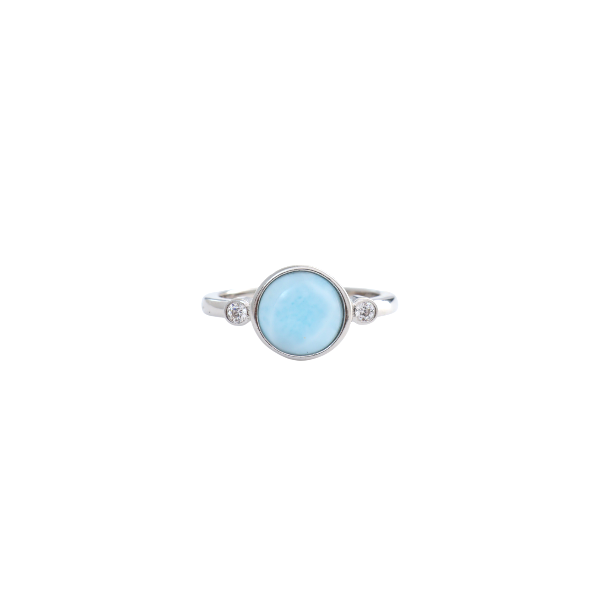 Round light blue larimar cabochon flanked by two small bezel set clear stones on a silver band.
