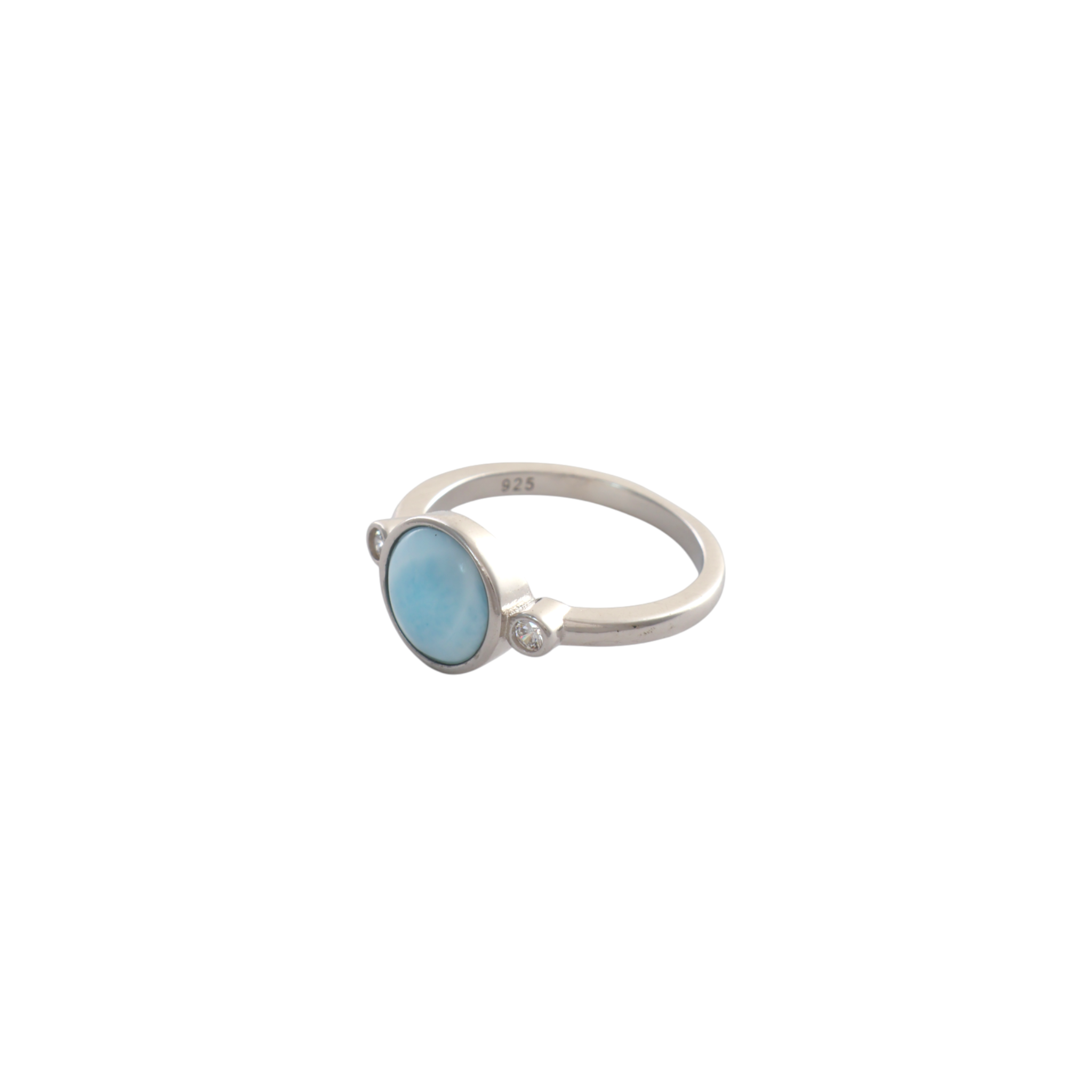 Round light blue larimar cabochon flanked by two small bezel set clear stones on a silver band.
