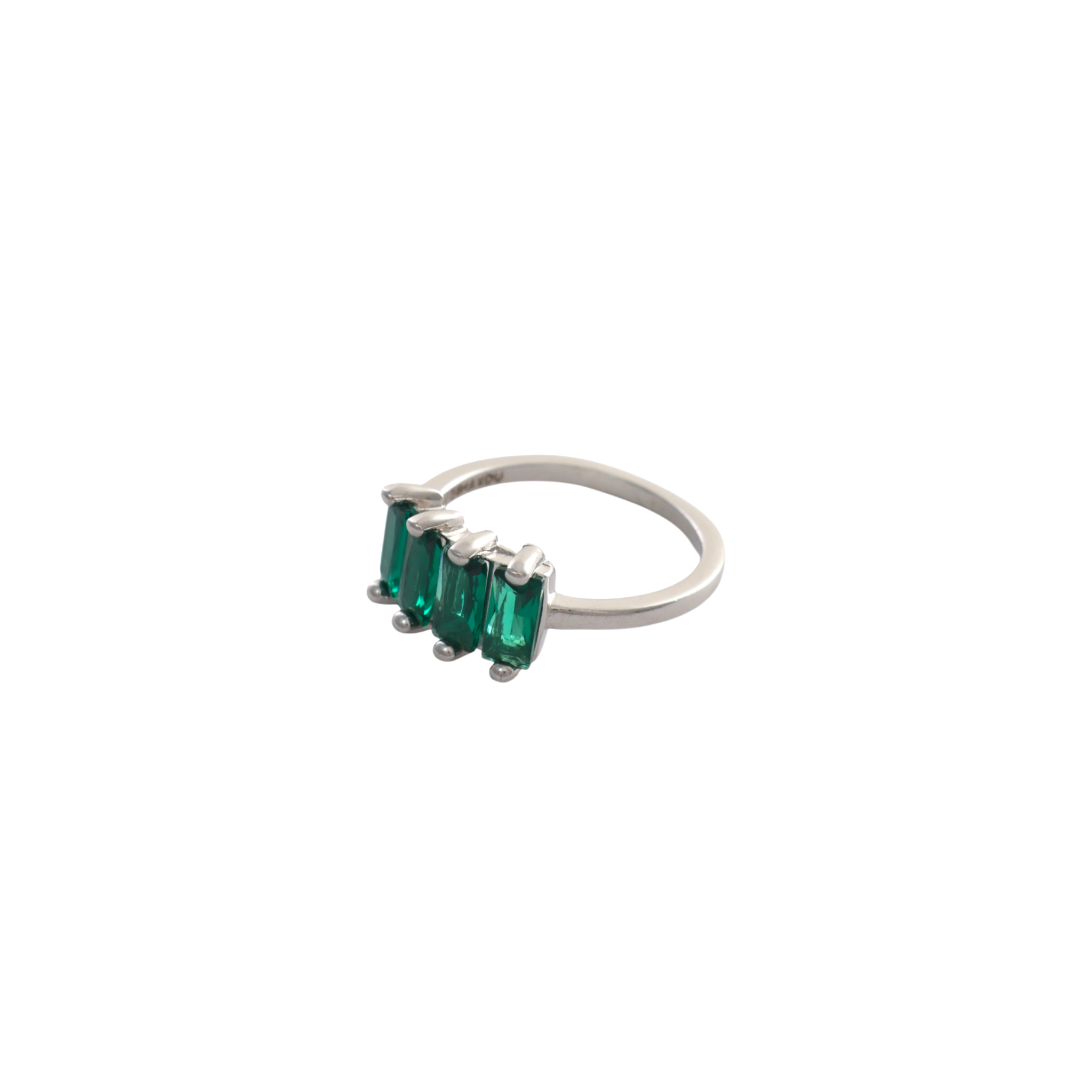Four emerald green vertical baguette cut stones set side by side in a silver ring.