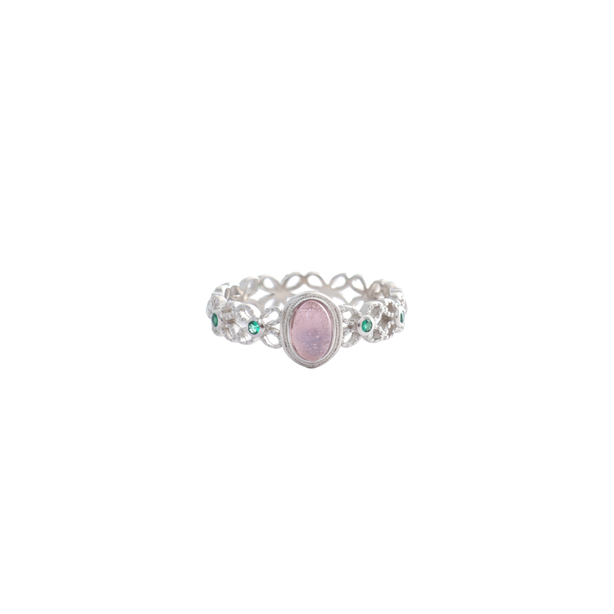 Pink oval center stone on an intricate filigree lace silver band studded with green accents.