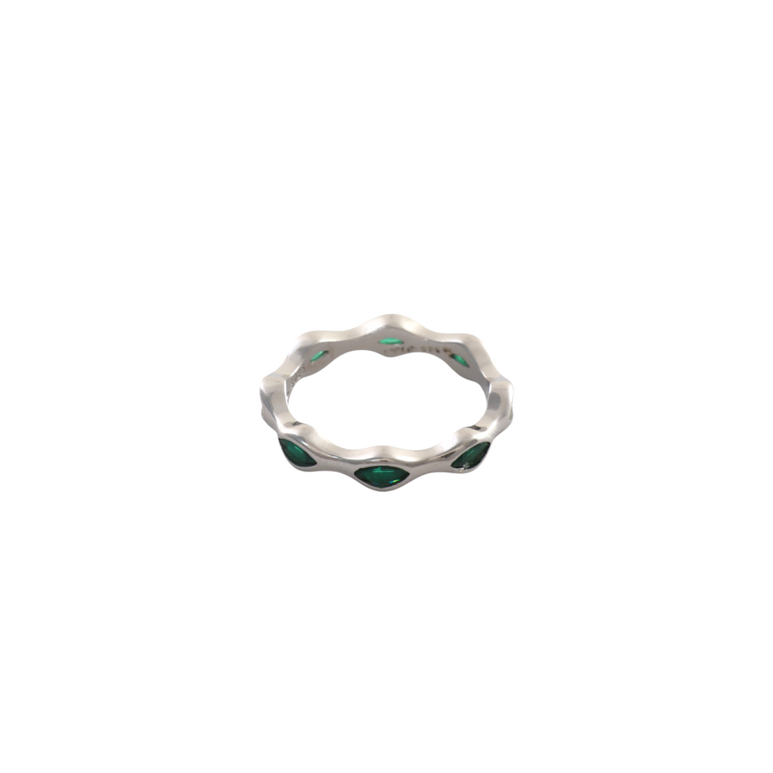 Fluid wavy silver eternity style band set with brilliant emerald green marquise gemstones.