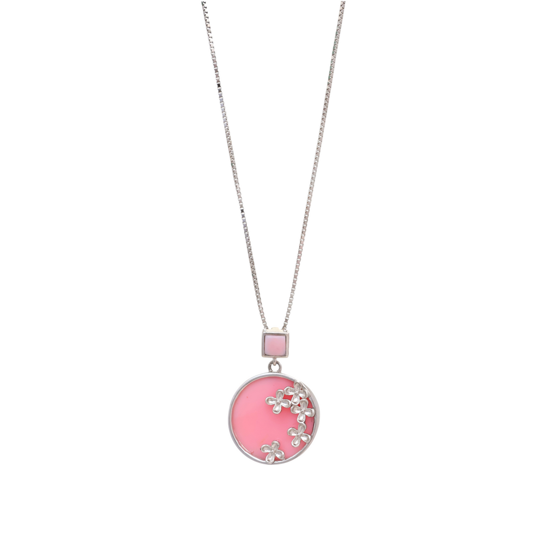 Silver-tone chain necklace with a pink round disc pendant adorned with silver flower appliques.