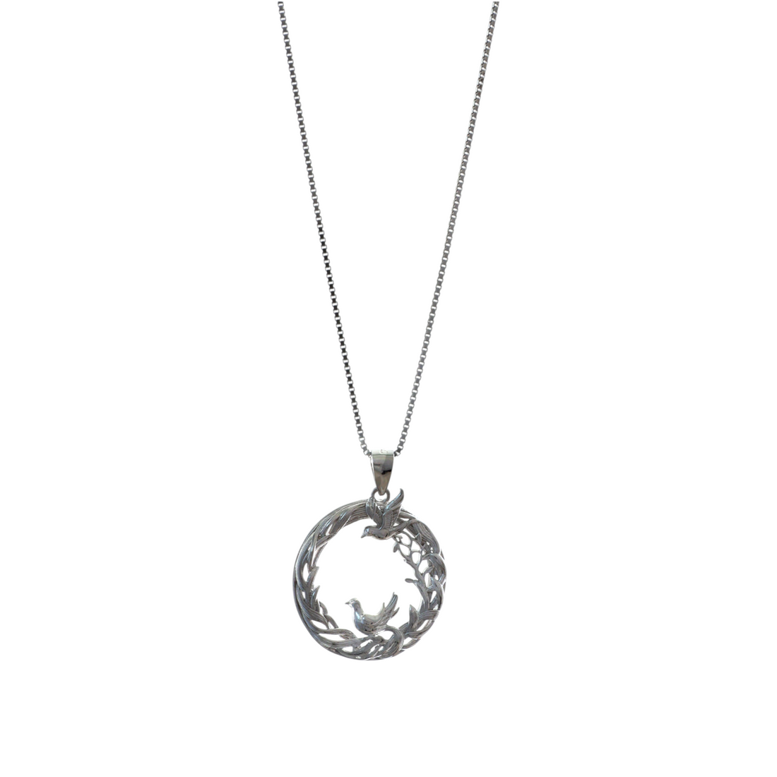 Silver chain necklace with a circular openwork pendant depicting doves and foliage branches.