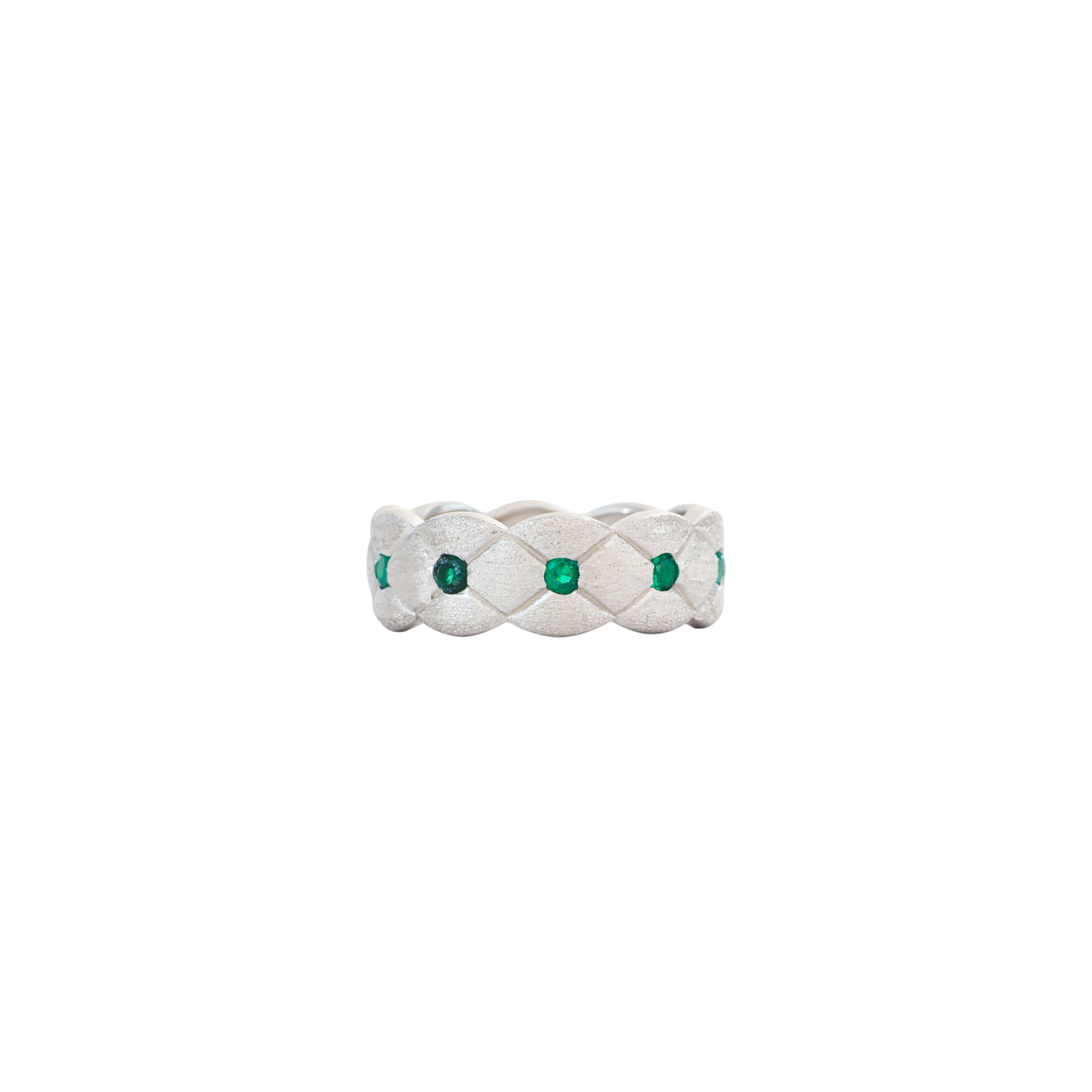 Brushed silver band with quilted lattice texture set with round green stones at intersections.