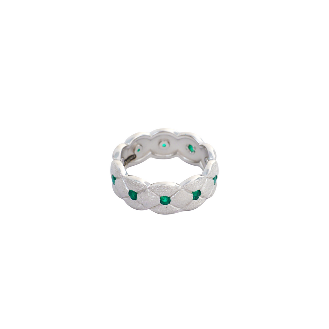 Brushed silver band with quilted lattice texture set with round green stones at intersections.