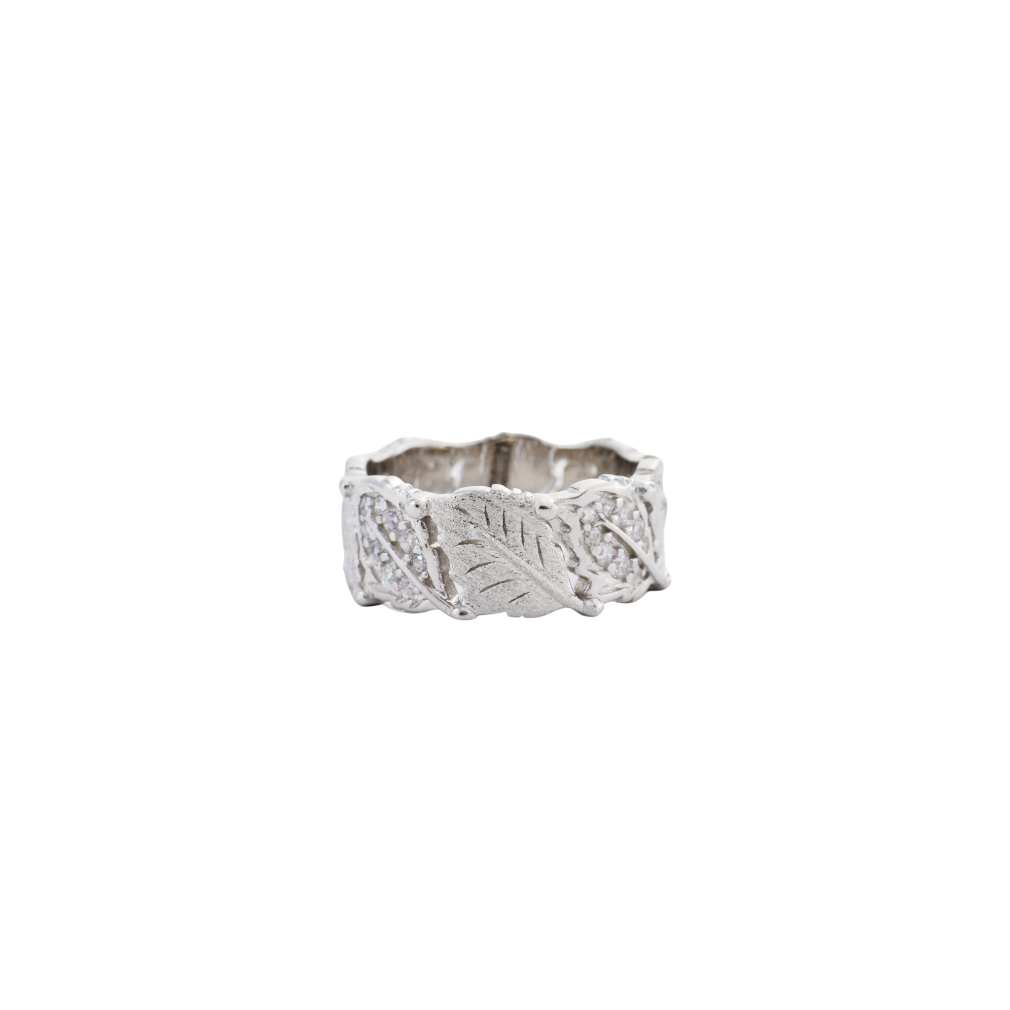 Wide silver band with carved leaf patterns and pave crystal accents on a brushed finish.